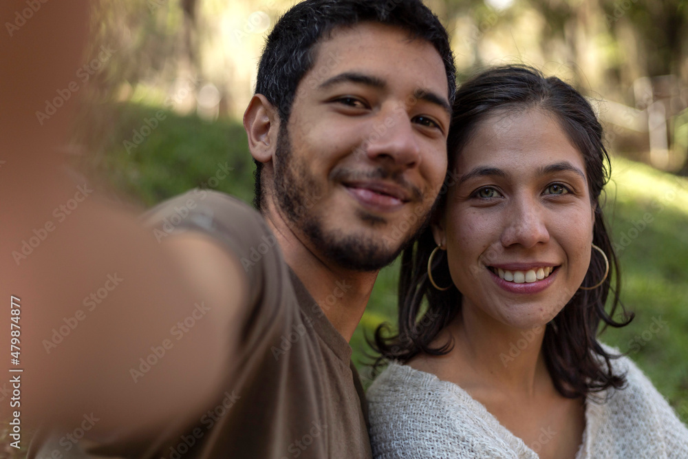 Two Latin American friends take a picture in the open air. Friendship concept Two Latin American friends take a picture in the open air. Friendship concept