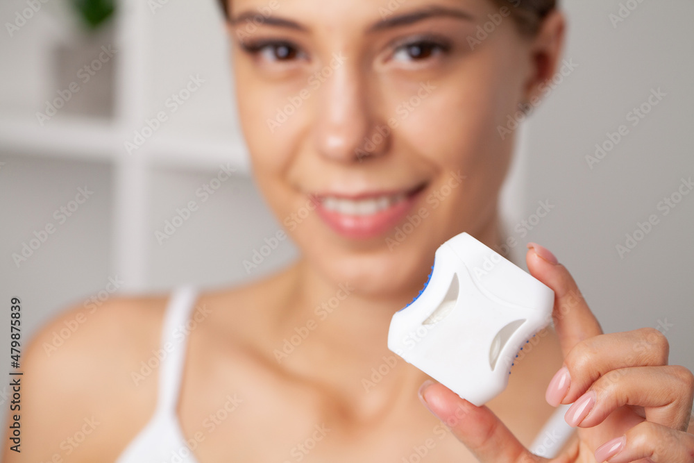 Smiling women use dental floss white healthy teeth. Smiling women use dental floss white healthy teeth.