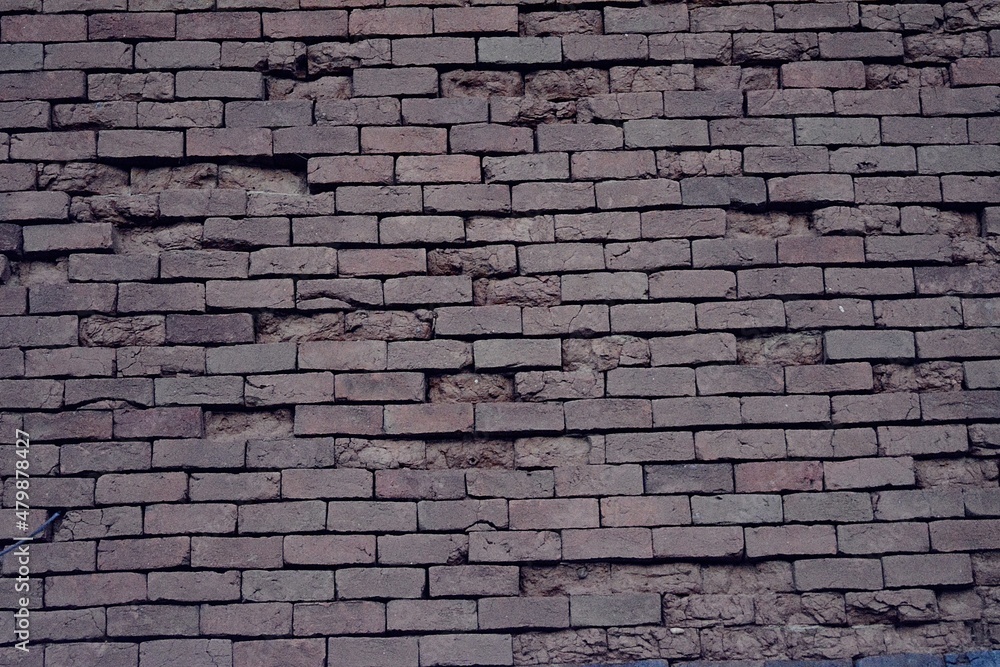 Obraz premium Old demolished brick wall