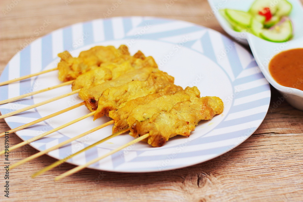 Pork satay,Grilled pork served with peanut sauce or sweet and sour sauce, Thai Street food.