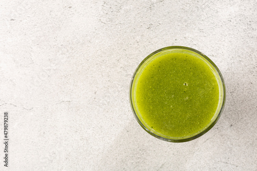 Healthy detox smoothie in glass cup. Detox drink.