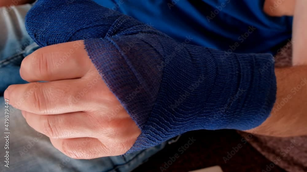Video „Blue surgical bandage on the arm. Medicine concept. Fractures