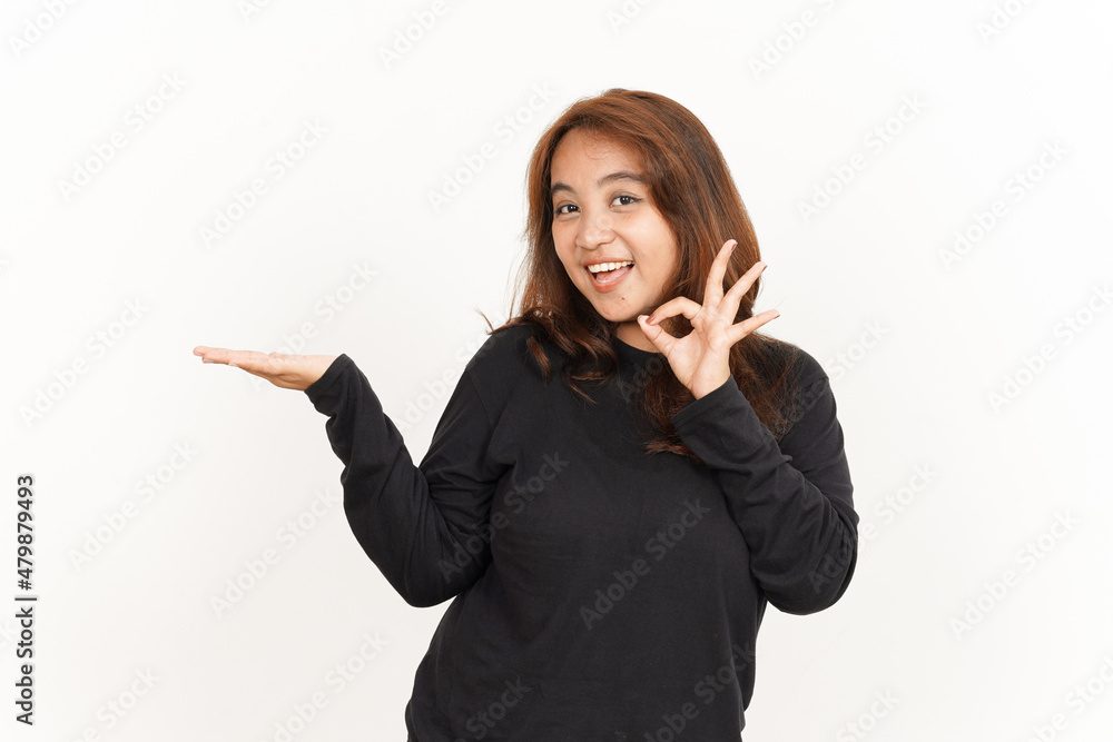 Showing and Presenting recommend product on open palm Of Beautiful Asian Woman Wearing Black Shirt Showing and Presenting recommend product on open palm Of Beautiful Asian Woman Wearing Black Shirt