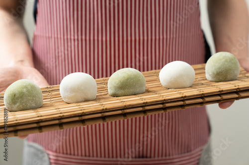 Japanese matcha and original flavor mochi or daifuku dessert on a white serving plate photo