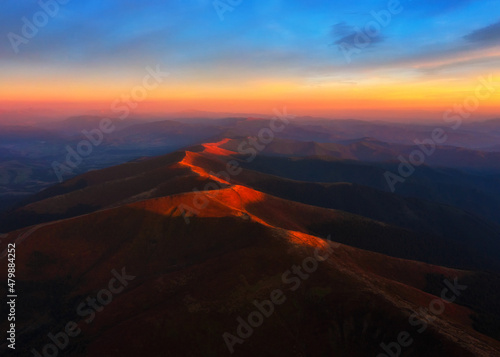 Aerial view on Mountain range at sunset