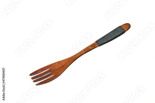 Stylish fork made of dark wood isolated on a white background. photo