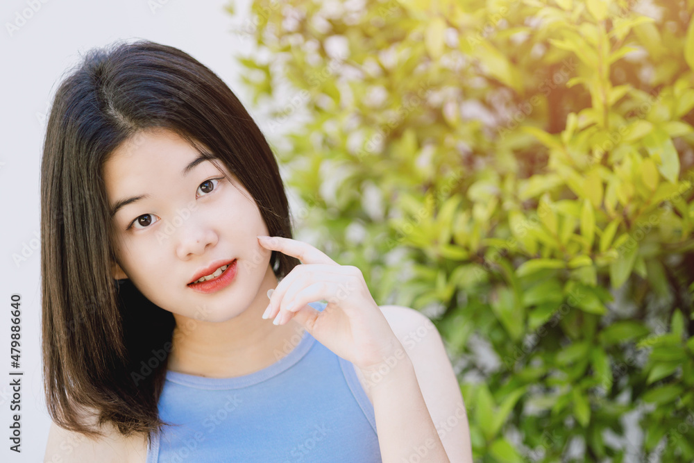 cute lovely portrait asian Thai teen smile with green nature copy space. cute lovely portrait asian Thai teen smile with green nature copy space.