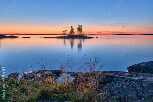 Sunset over the lake whit the view of small island