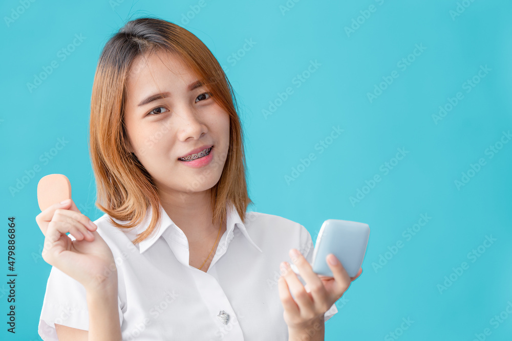 Asian university teen girl hand holding makeup face powder beauty happy smile Asian university teen girl hand holding makeup face powder beauty happy smile