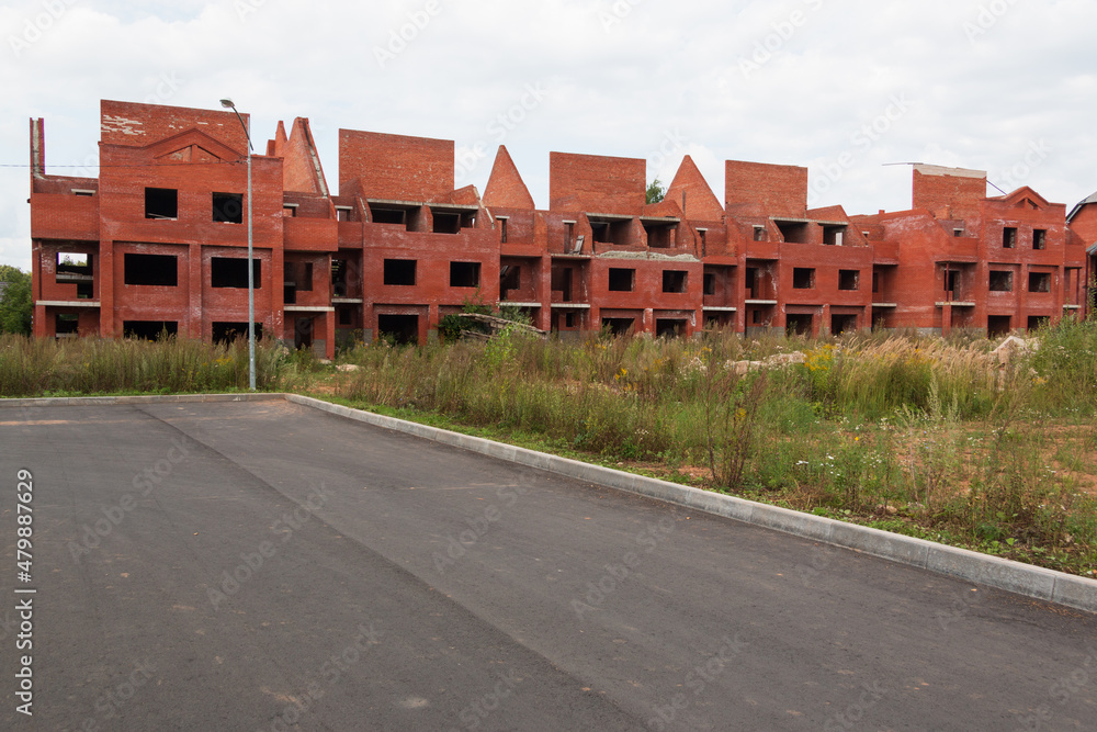 unfinished red brick apartment building unfinished red brick apartment building