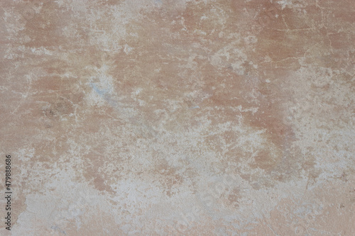 Old beige wall with brown spots covered with cement. Ugly wall but beautiful texture.