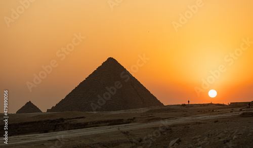 Stunning sunset behind the Great Pyramids of Giza  Egypt