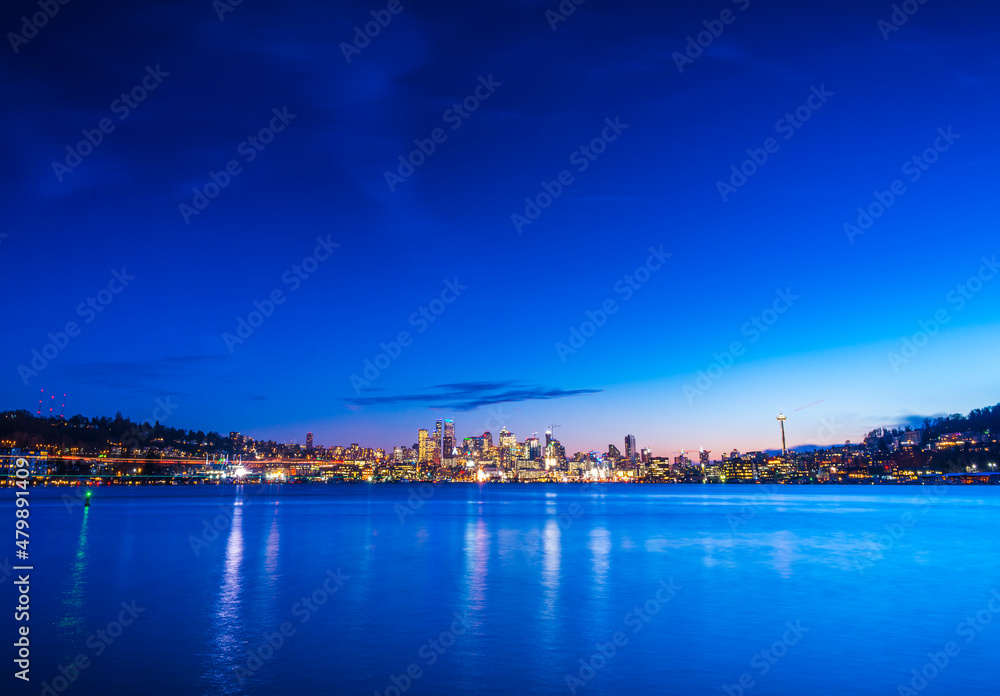 seattle city skyline at night with reflection in water. seattle,washington,usa.