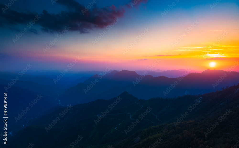Obraz premium Mountain peaks landscape at sunset.