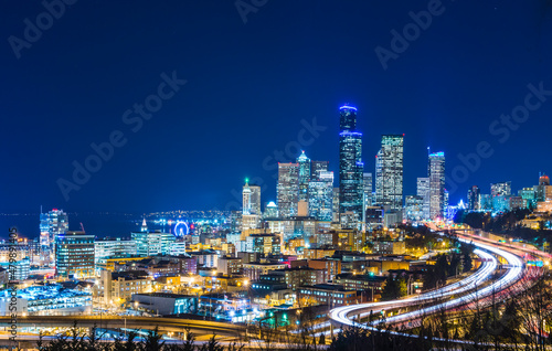 Seattle skylines and Interstate freeways converge at sunset, Seattle, Washington, USA.