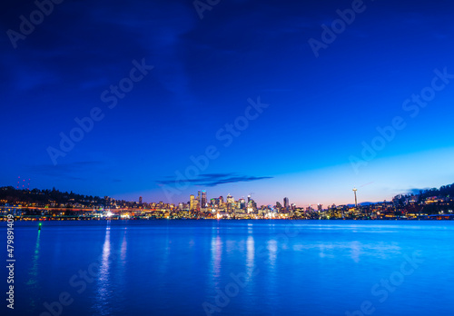 seattle city skyline at night with reflection in water. seattle,washington,usa. © checubus