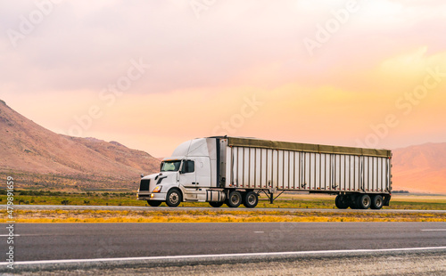 Truck transportation on the road at sunset