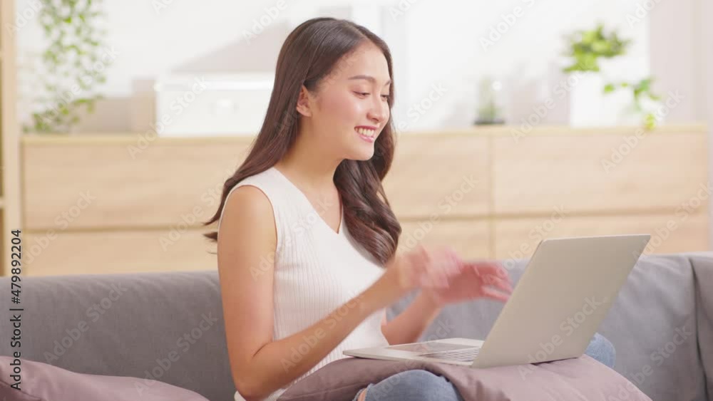 Asian young woman wear pink sweater online meeting Video conference call with business team or family at home,young girl live streaming in social media online platform,Lifestyle at home concept Asian young woman wear pink sweater online meeting Video conference call with business team or family at home,young girl live streaming in social media online platform,Lifestyle at home concept