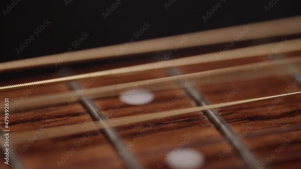 A string moves in very slow motion after being plucked. A string moves in very slow motion after being plucked.