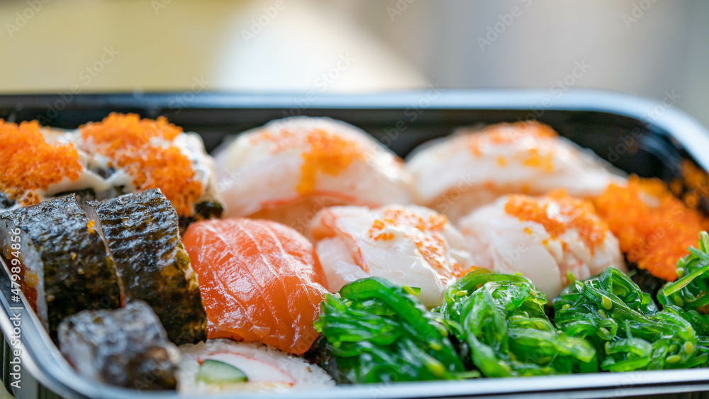 Japanese food. ็Philadelphia roll sushi with salmon, prawn, avocado, cream cheese. Sushi menu, looks delicious. Japanese food. ็Philadelphia roll sushi with salmon, prawn, avocado, cream cheese. Sushi menu, looks delicious.