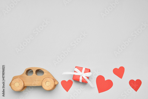 Wooden car with paper heart...