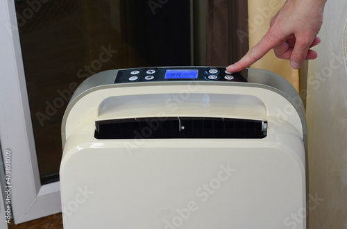 Modern technology house dehumidifier, control of temperature and indoor climate photo