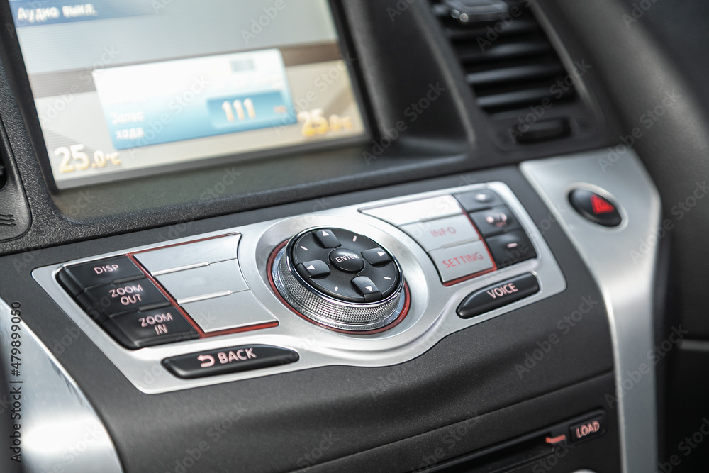 Car control panel of audio player and other devices.A shallow depth of field close up of the control panel of a car.. Car control panel of audio player and other devices.A shallow depth of field close up of the control panel of a car..