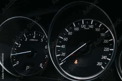 close up of the speedometer with rpm and km meter