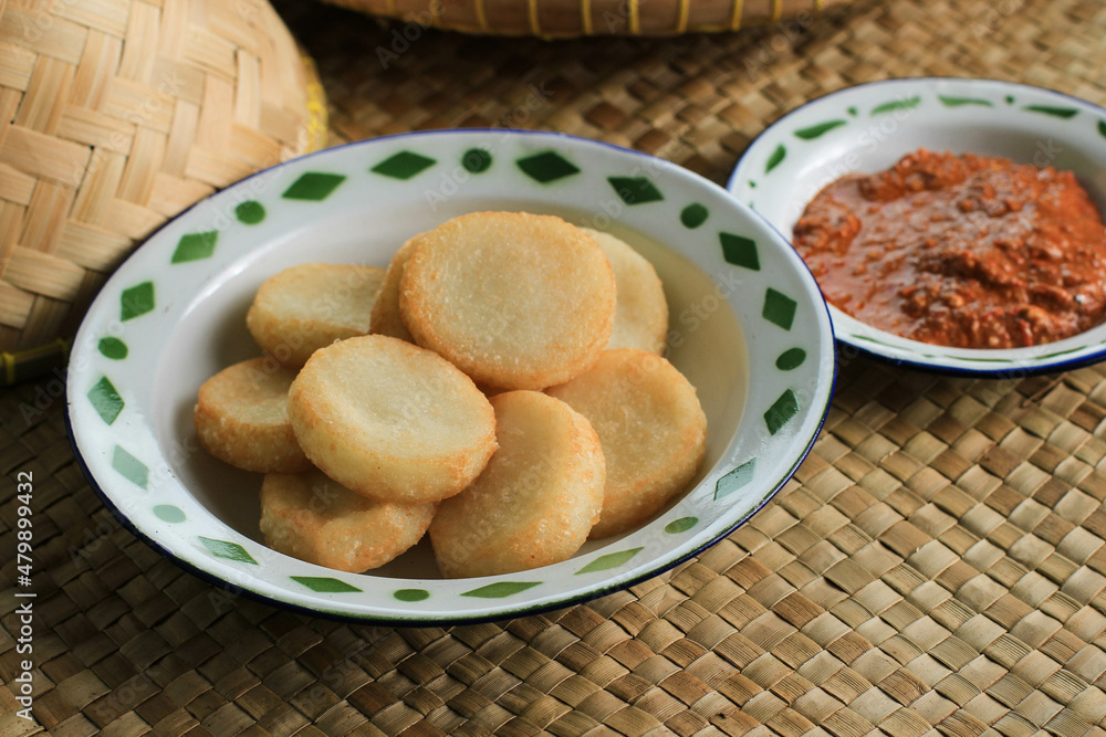 Ulen Ketan, Indonesian Traditional Snack Made from Steam Sticky Rice, Compressed or Shaped and then Deep Fried, Served with Sambal Oncom Ulen Ketan, Indonesian Traditional Snack Made from Steam Sticky Rice, Compressed or Shaped and then Deep Fried, Served with Sambal Oncom