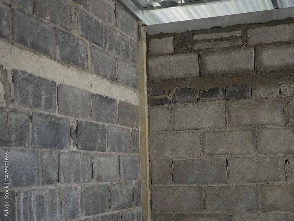 Masonry worker make concrete wall by cement block and plaster. closeup photo, blurred. Masonry worker make concrete wall by cement block and plaster. closeup photo, blurred.