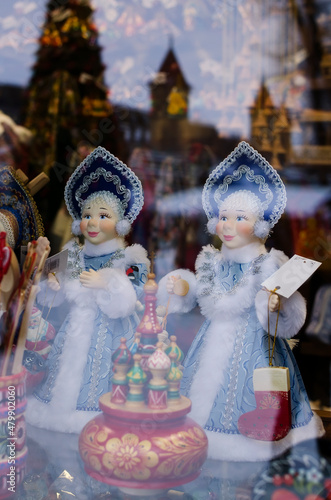 Russian winter folk souvenirs on the showcase on fair - Christmas toys, New Year's figurines of snegyrochka. Craft, handicrafts, handicrafts © Olga Kravchenko