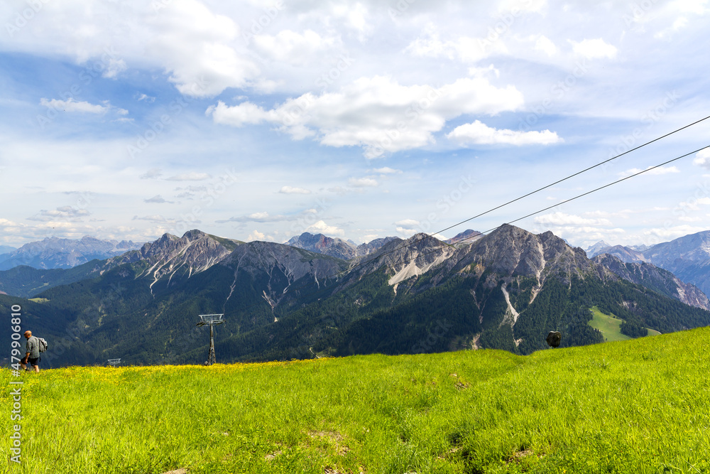 Obraz premium A beautiful view of Kronplatz (Plan de Corones) with mountain range in background