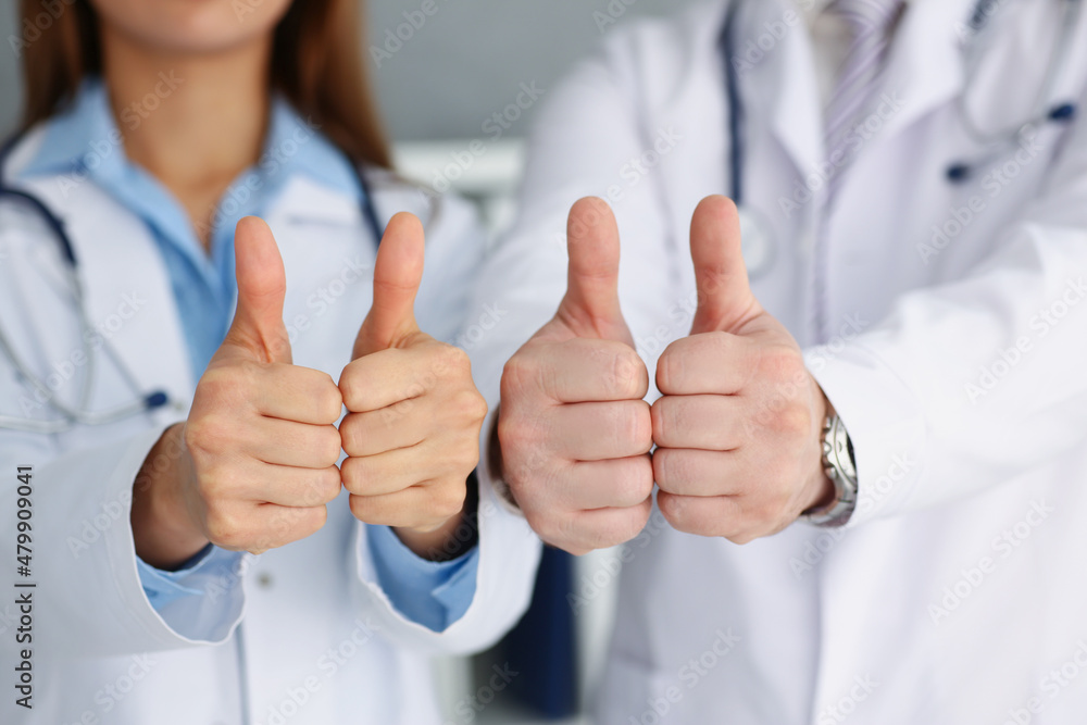 Doctors hands show ok or confirm sign with thumb up Doctors hands show ok or confirm sign with thumb up