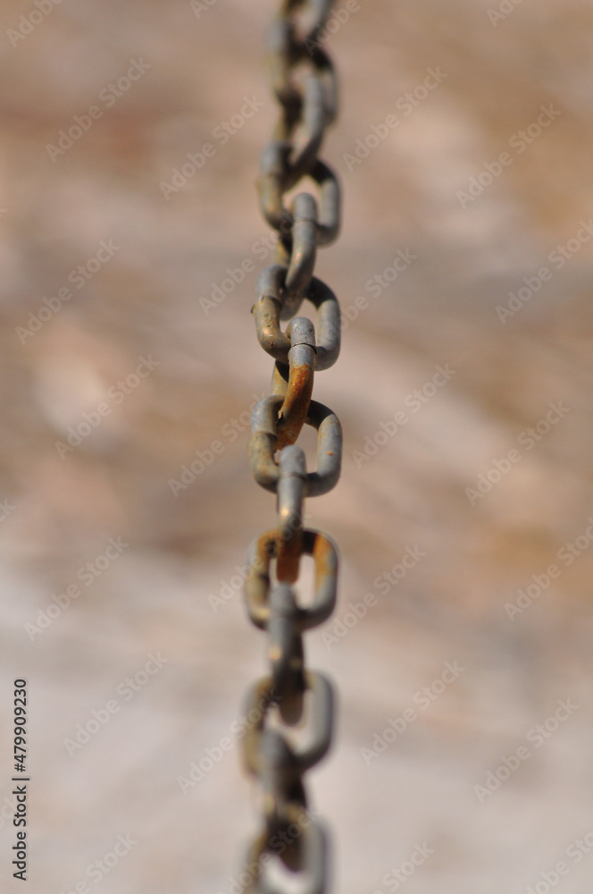 Rusty steel chain shot in perspective with shallow depth of field, soft focus Rusty steel chain shot in perspective with shallow depth of field, soft focus