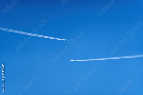 Two airplanes passing by each other