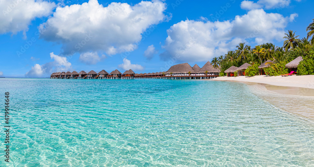 Amazing panorama at Maldives. Luxury resort villas seascape with tropical island coast, shore bright sky. Beautiful beach background for vacation holiday tourism, ocean lagoon. Seaside island hotel