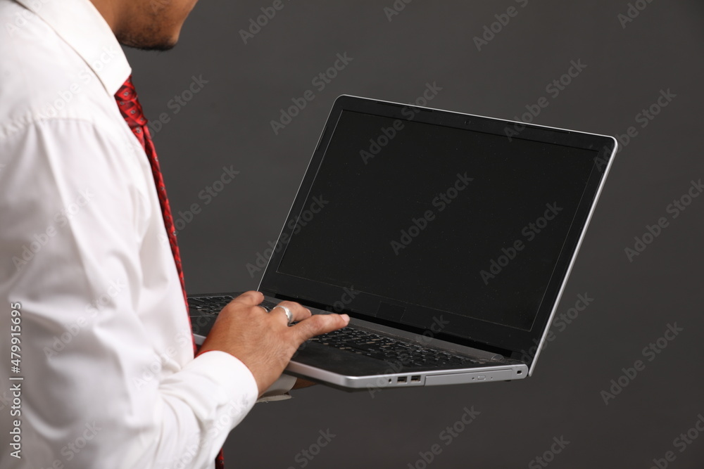 Young indian banker or officer using laptop Young indian banker or officer using laptop