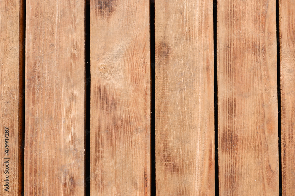 Obraz premium Vertical wooden background texture surface. Brown wooden vintage background with Copy Space. Sanded wooden beams. Close-up view.