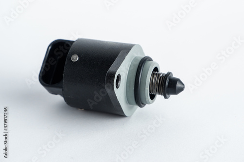 Auto parts . Car injector engine idler . close up on white background. idle air control valve