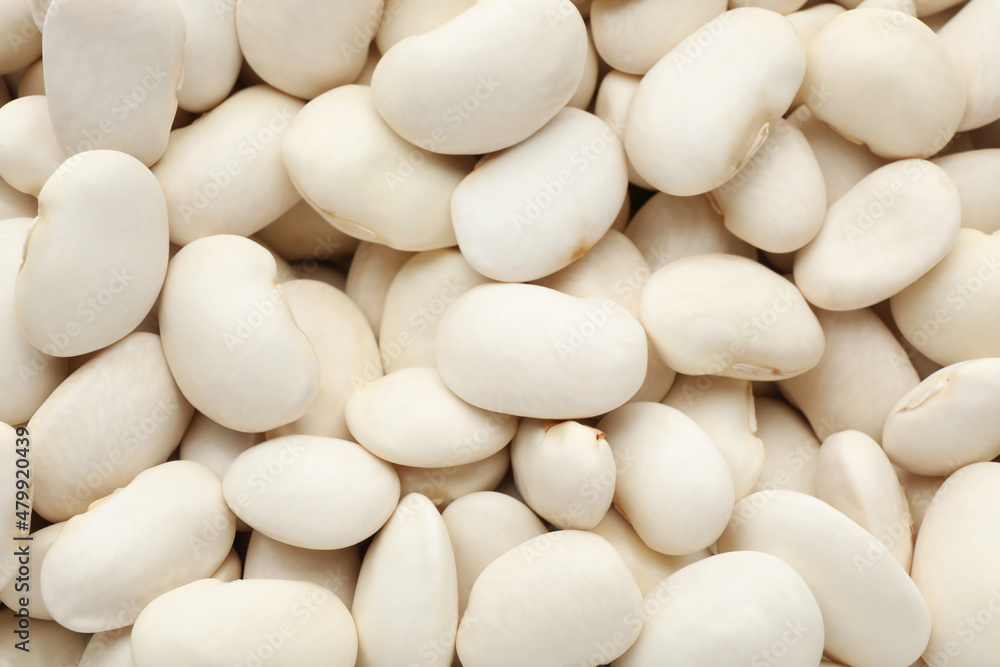 Pile of uncooked white beans as background, closeup Pile of uncooked white beans as background, closeup