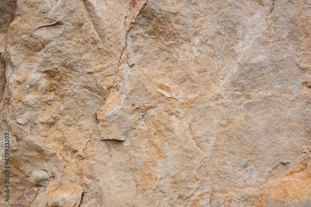 Natural stone background detail in warm tone. Texture