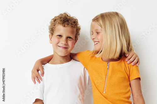 Small children casual clothes posing emotions studio isolated background unaltered