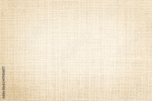 Jute hessian sackcloth burlap canvas woven texture background pattern in light beige cream brown color blank. Natural weaving fiber linen and cotton cloth texture as clean empty for decoration.