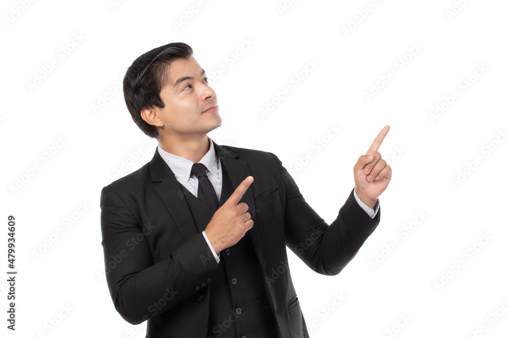 Portrait of a confident business man in black suit smile and pointing to copy space isolated on white background. Portrait business concept. Portrait of a confident business man in black suit smile and pointing to copy space isolated on white background. Portrait business concept.