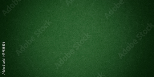 Elegant dark emerald green background with black shadow border and old vintage grunge texture design  © gojalia