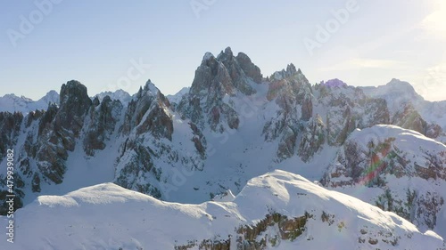 Amazing aerial view of mountains in winter with snow and in a sunny day.