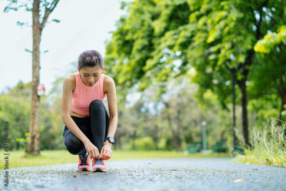 asian young woman stretching in park, lifestyle and health concept. asian young woman stretching in park, lifestyle and health concept.