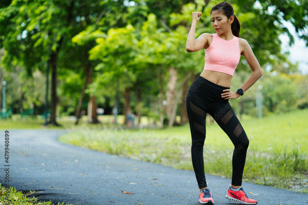 asian young woman stretching in park, lifestyle and health concept.
