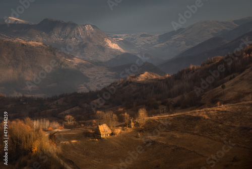 Atmospheric view of an old abandoned hut in traditional Romanian style. Natural background. Apuseni National Park. Carpathians. Romania