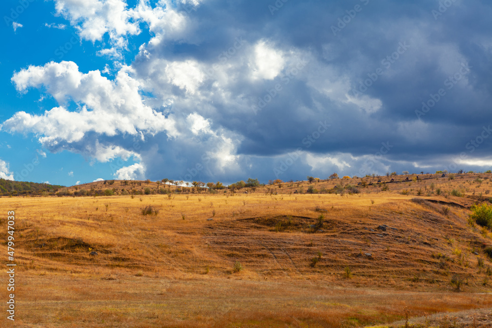 Fototapeta premium Low clouds over the hill . Autumn rolling hills scenery 